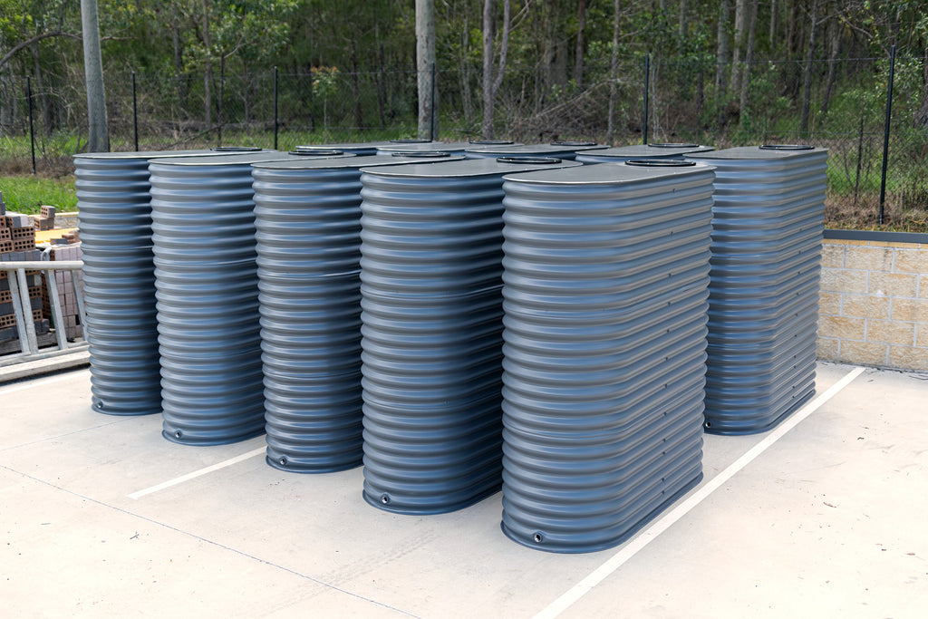 ten basalt steel tanks for a taree development all lined up