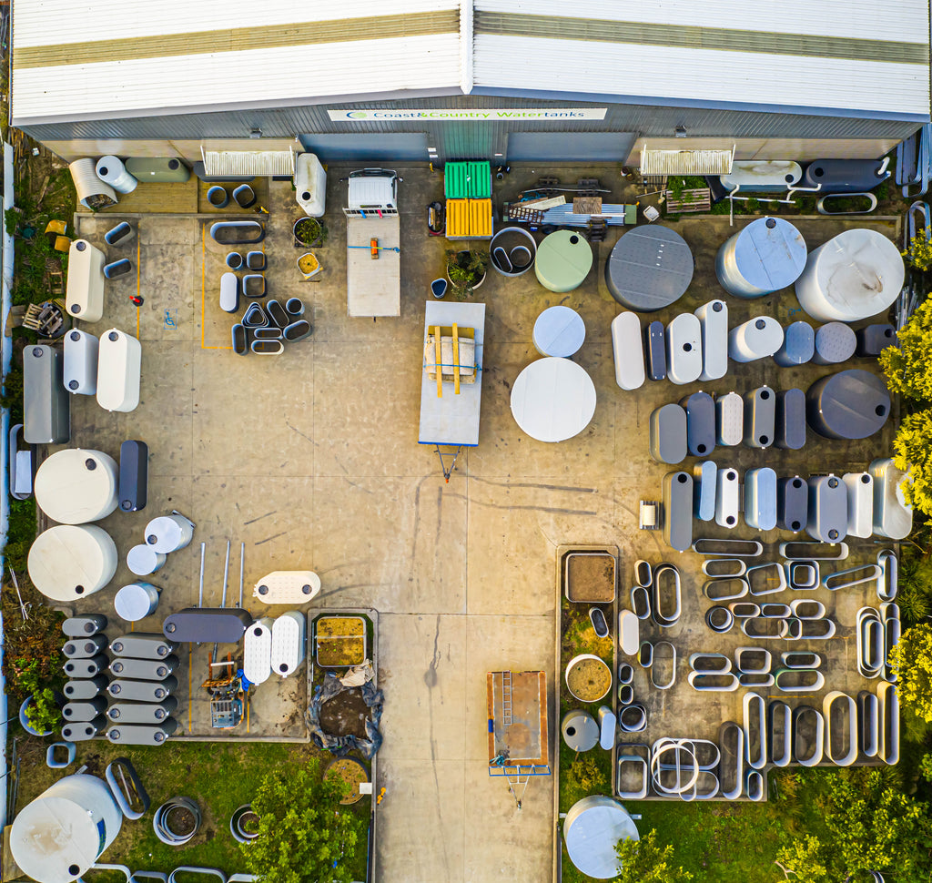 aerial photo of the coast and country water tanks factory with discounted tanks outside