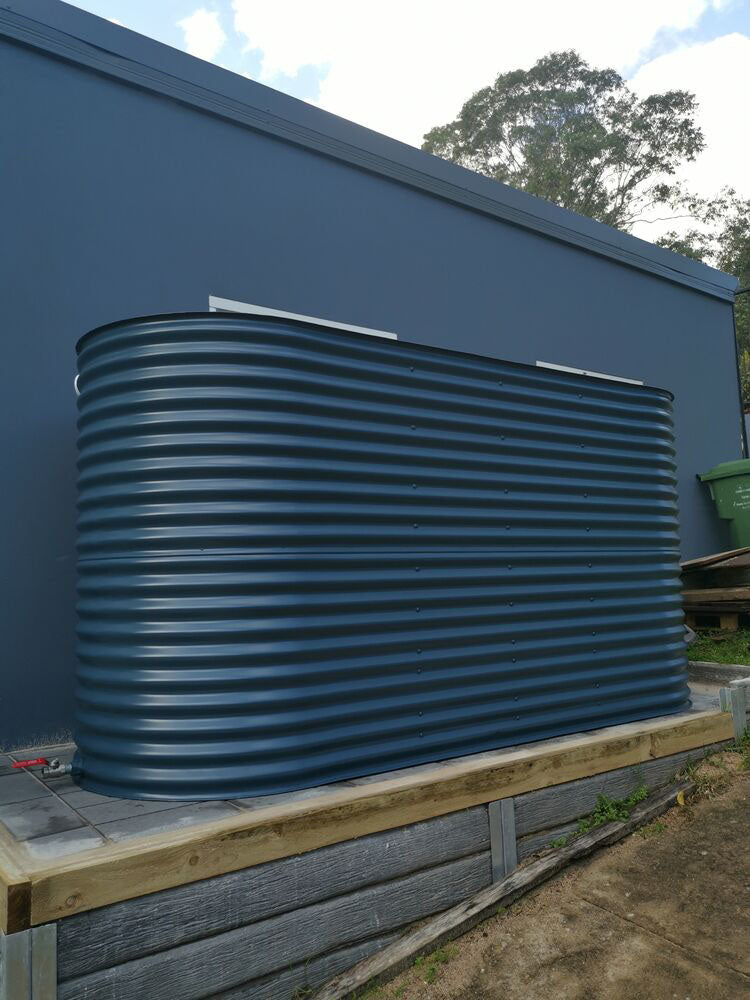ccwt large steel slimline tank in front of shed in colorbond deep ocean